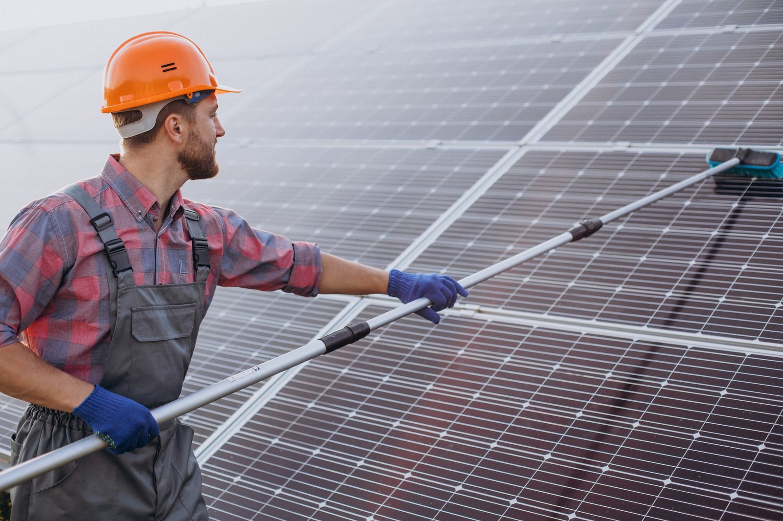 Solar panel cleaning in Las Vegas by Desert Window Services — professional technician cleaning residential solar panels