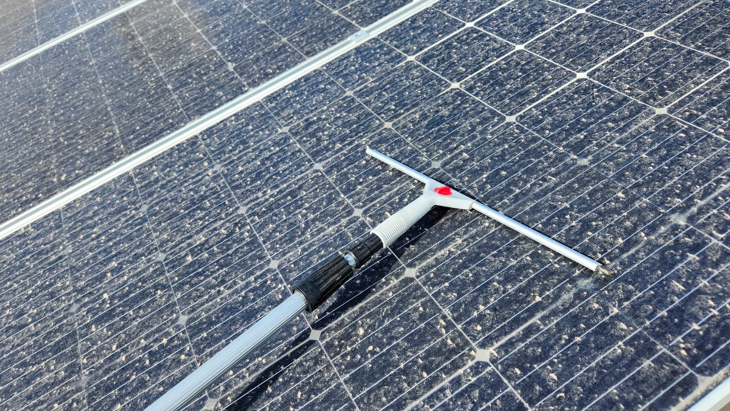 Desert dust covered solar panels Las Vegas — professional solar panel cleaning by Desert Window Services restores efficiency